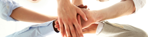 Hands piled up between four people